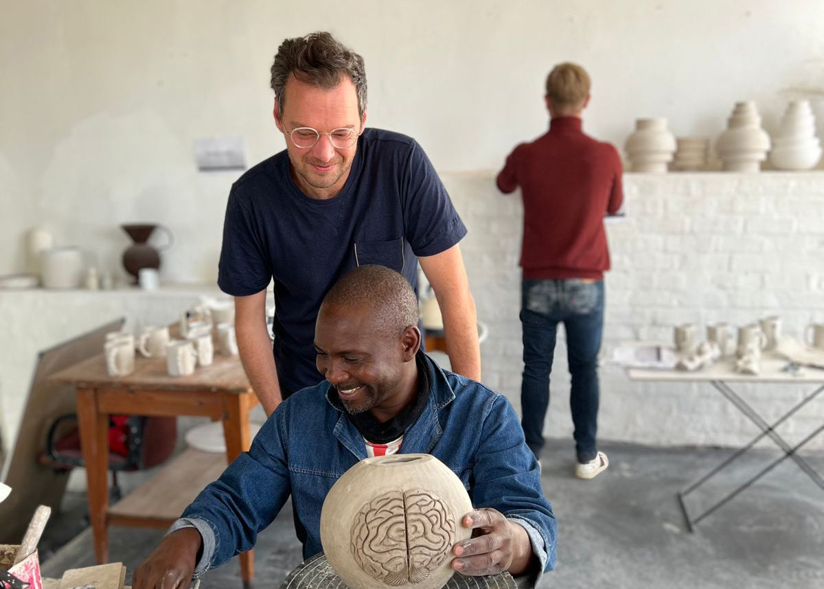the Rialheim team in their studio on Clairvaux Robertson with Rial, Daniel and the sculptor