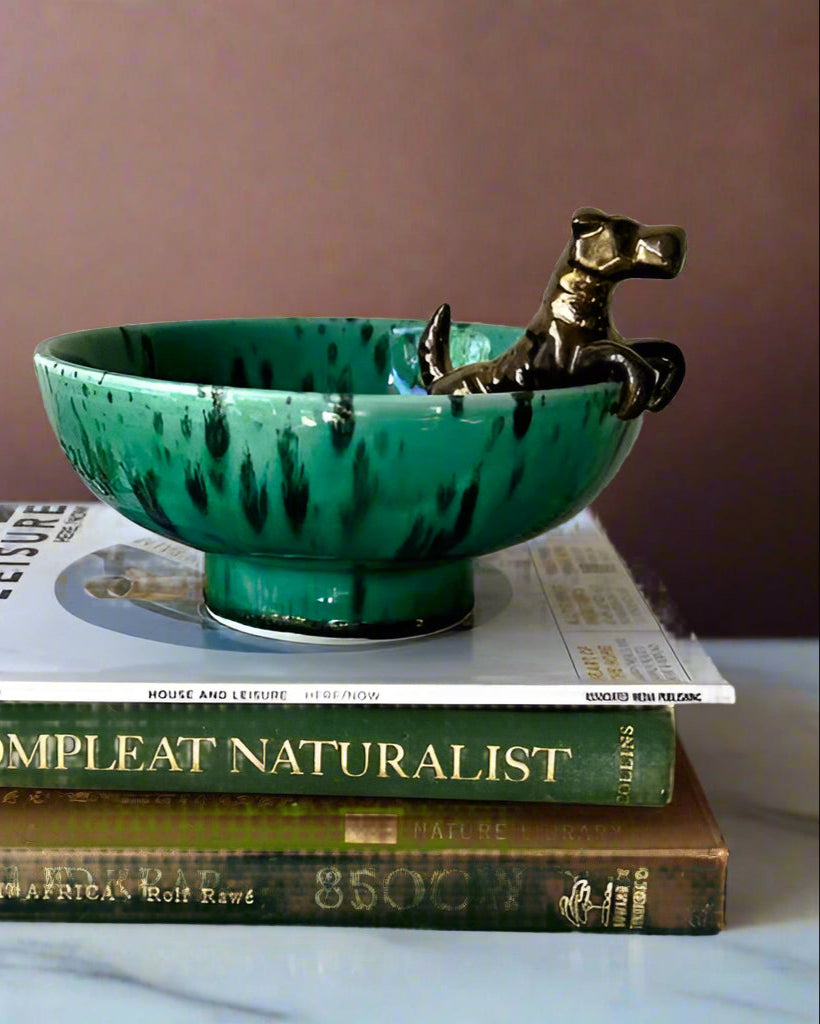 Green ceramic bowl with gold Scottish terroir Dog on top of books