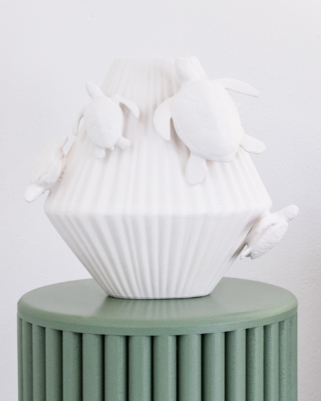 Matt White decorative vase with 3d sea turtles attached on a matching pedestal