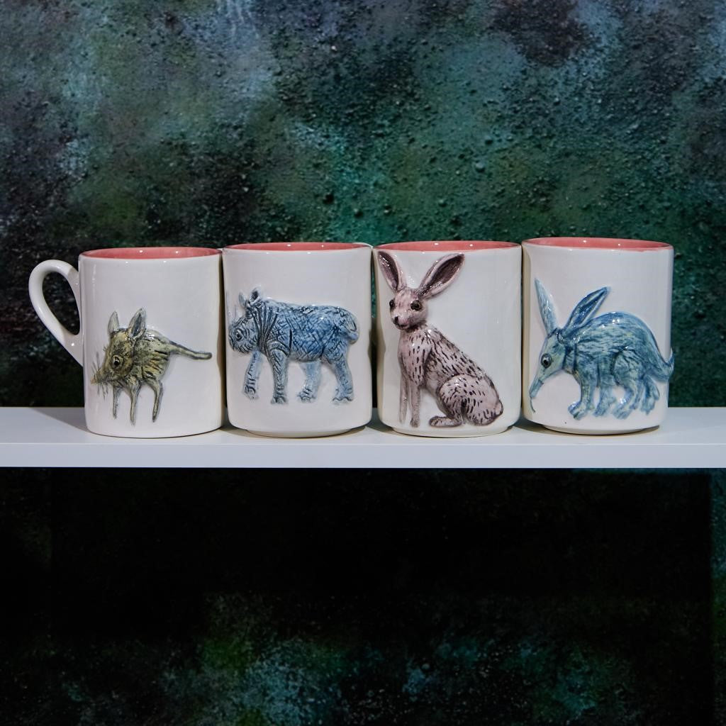 A Collection of hand painted Rialheim mugs including the rhino, the elepohant field mouse the riverine rabbit mug as well as the aardvark