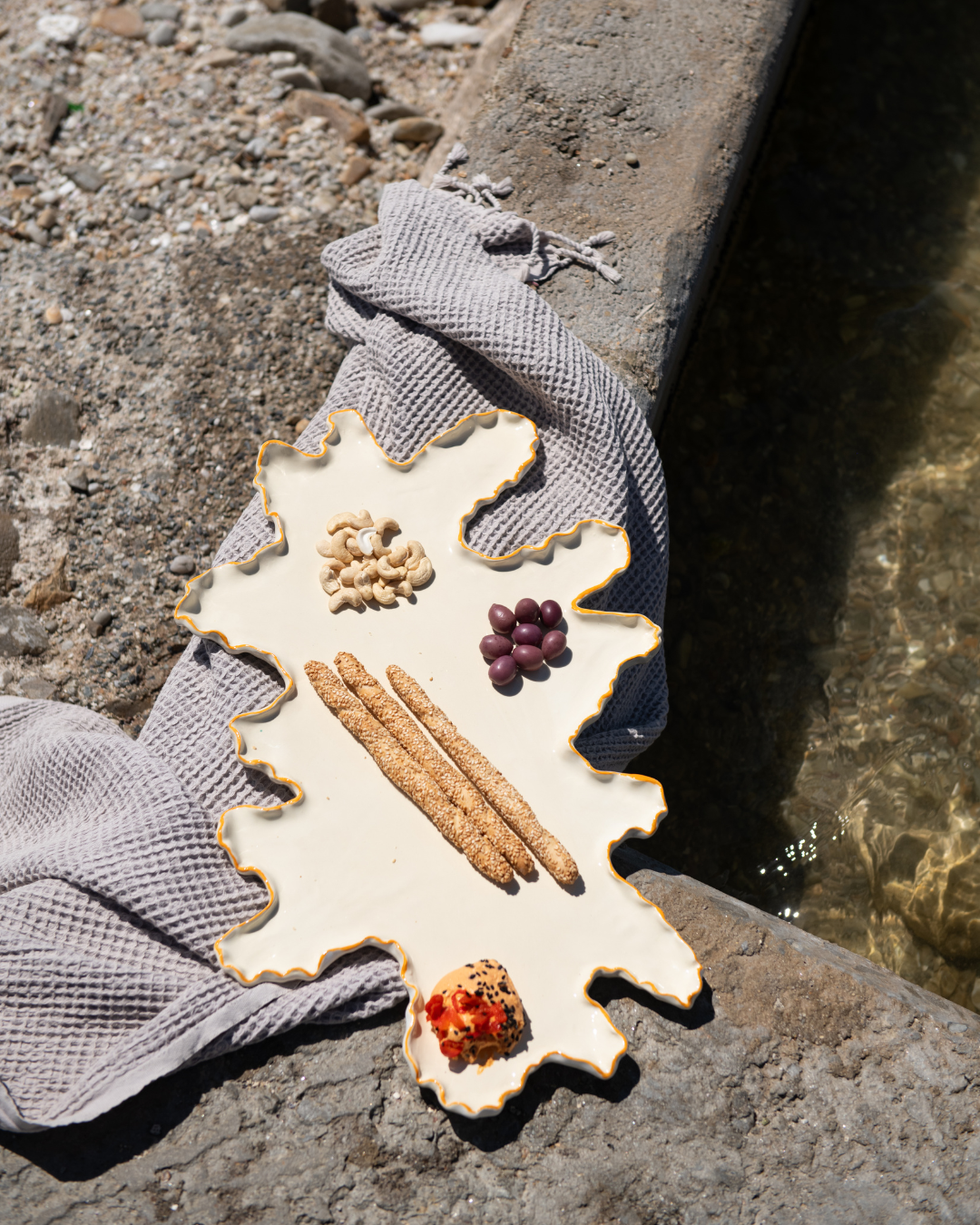 Decorative Saffron Coral Reef Mermaid Platter; with natural elements on a stone surface