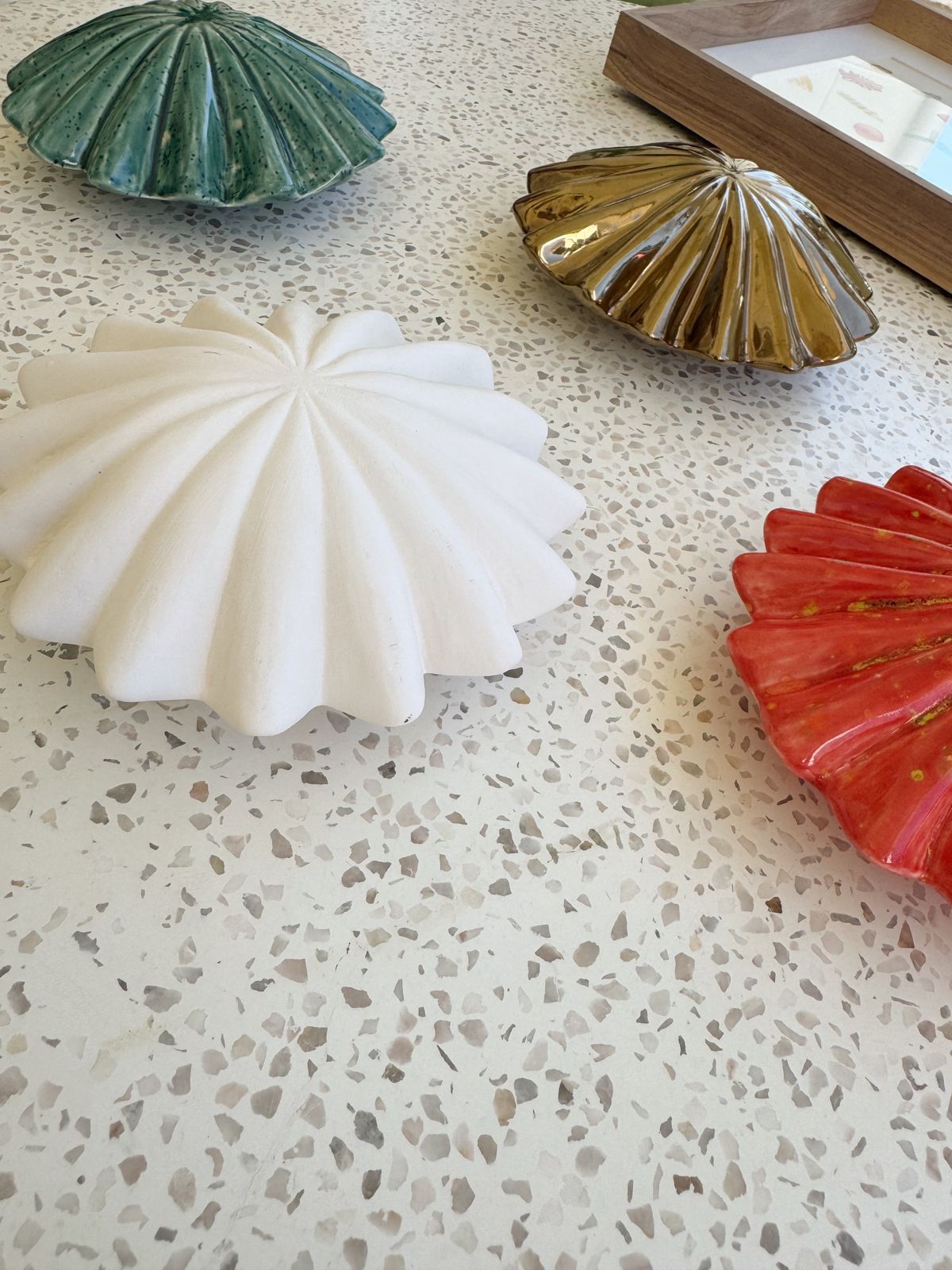 Decorative shell-shaped objects on a textured surface