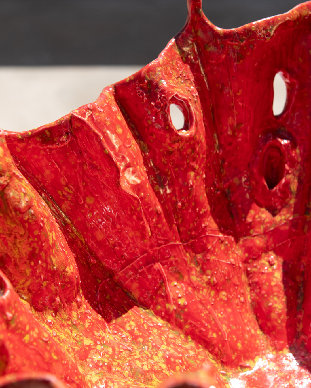 Close-up of a red bowl with a blurred background