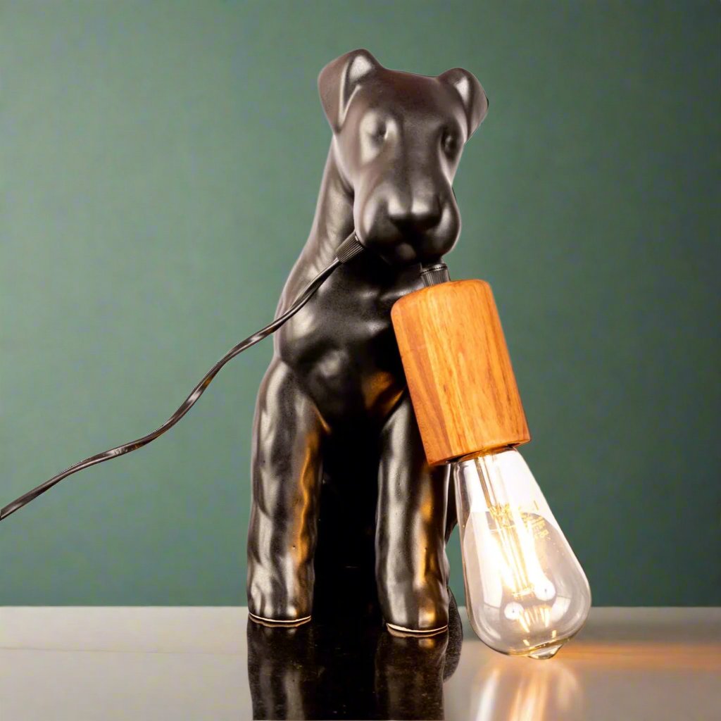 Rialheim_AIREDALE TABLE LAMP_A table lamp shaped like an Airedale dog holding the bulb_Ceramics_MadeinSoutAfrica_Gifts