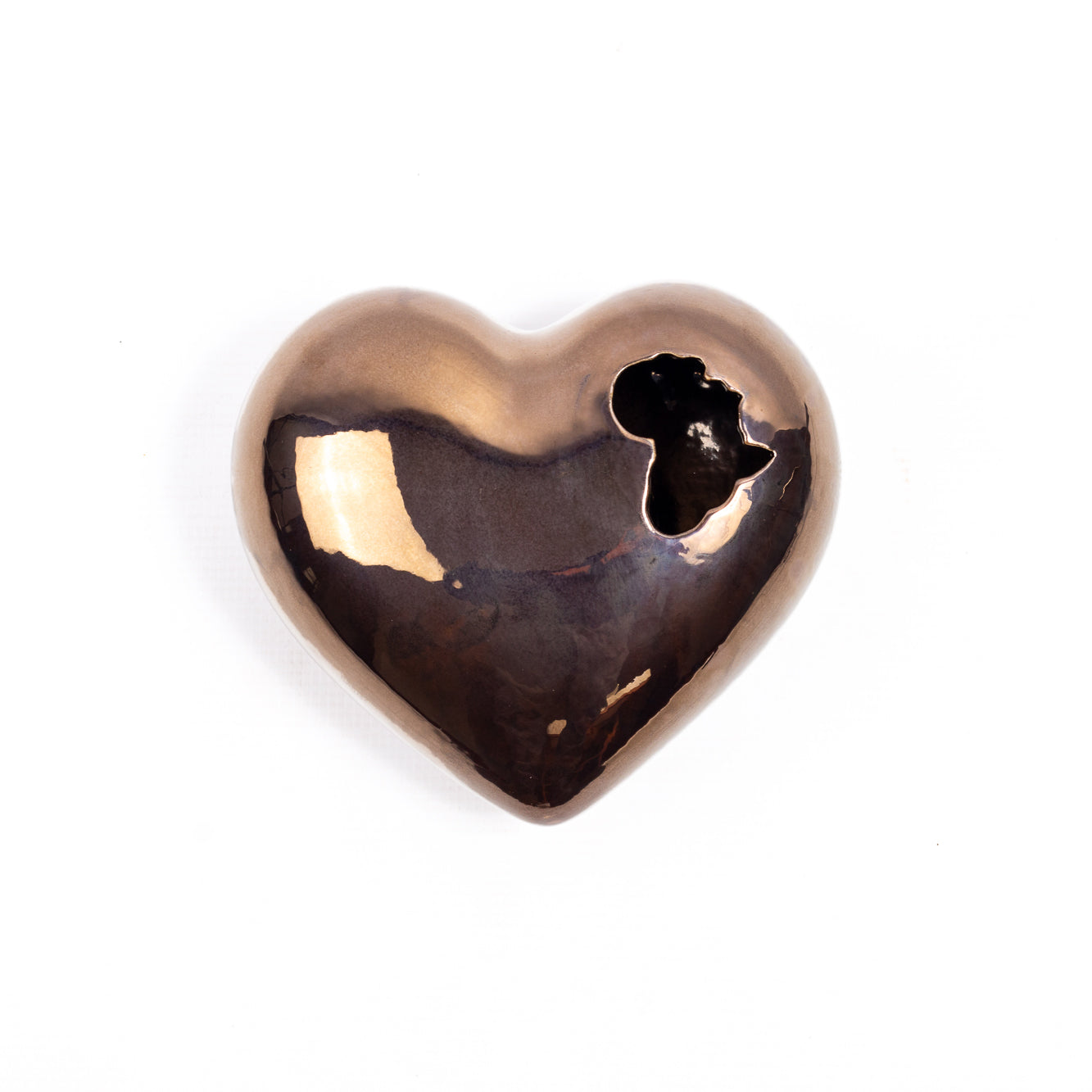 A handcrafted ceramic heart-shaped wall art piece, with intricate details and an African-inspired design, perfect for adding a touch of cultural pride and beauty to any home decor.