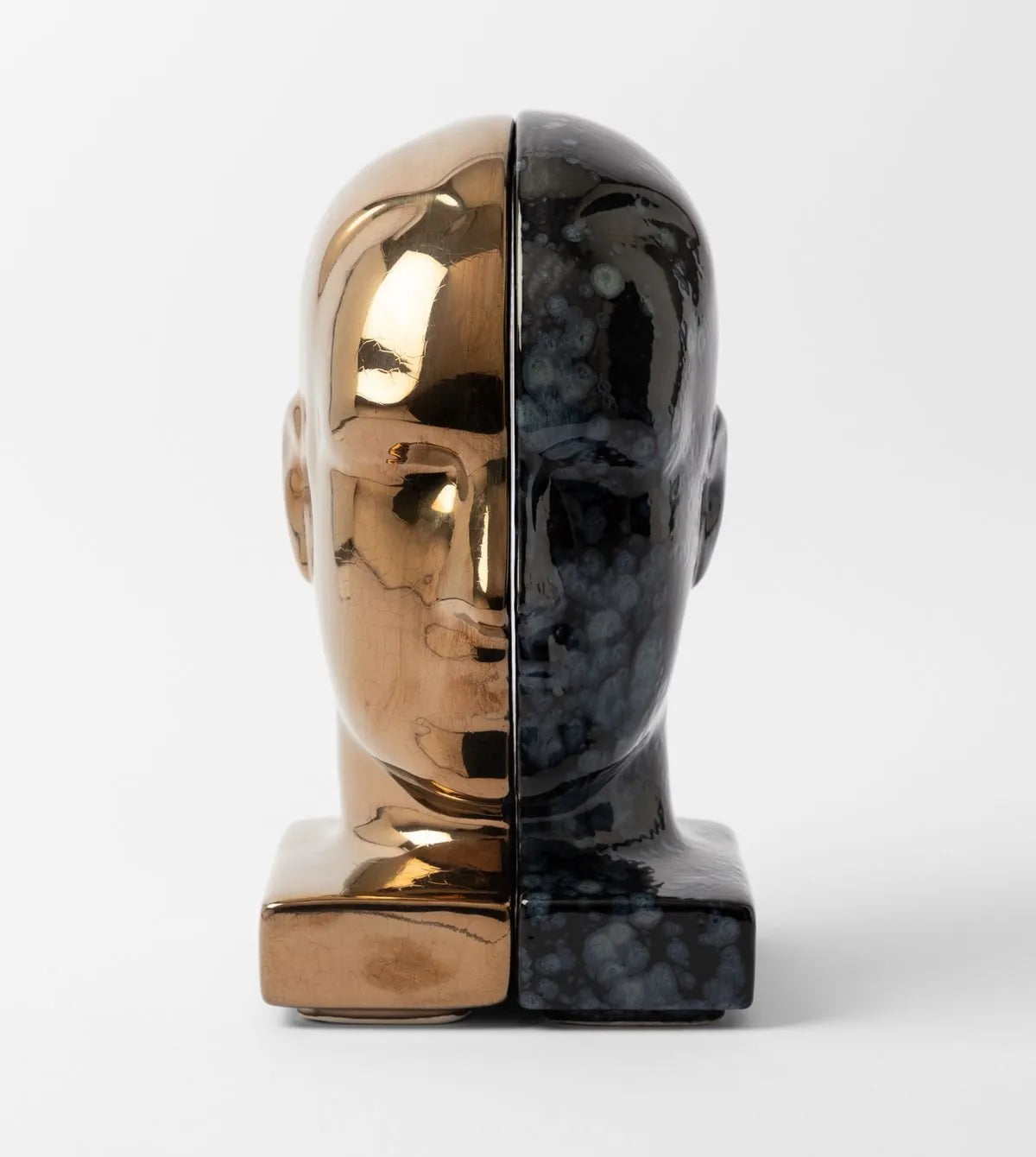 Bookend with gold and black marble design on a white background
