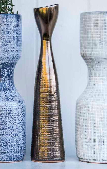 Bronze Candle Stick that is scratched at the surface