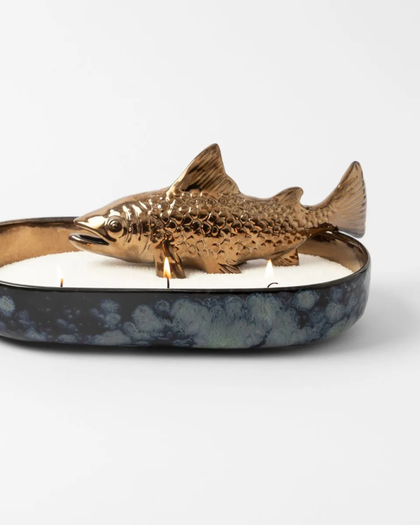 Bronze fish candle holder on a white background