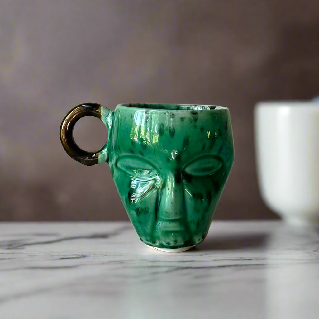 Rialheim Mug with Ethnic Face in Green Emerald Glaze and a round bronze Handle