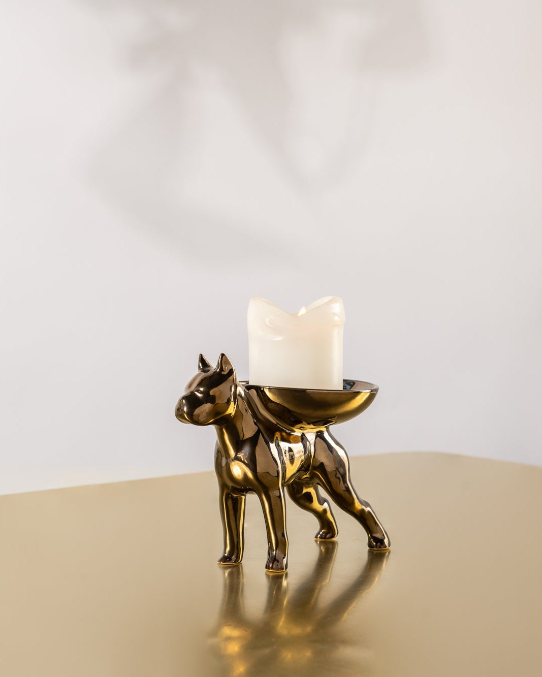 Bruno Candle Holder in Bronze with a candle on his back