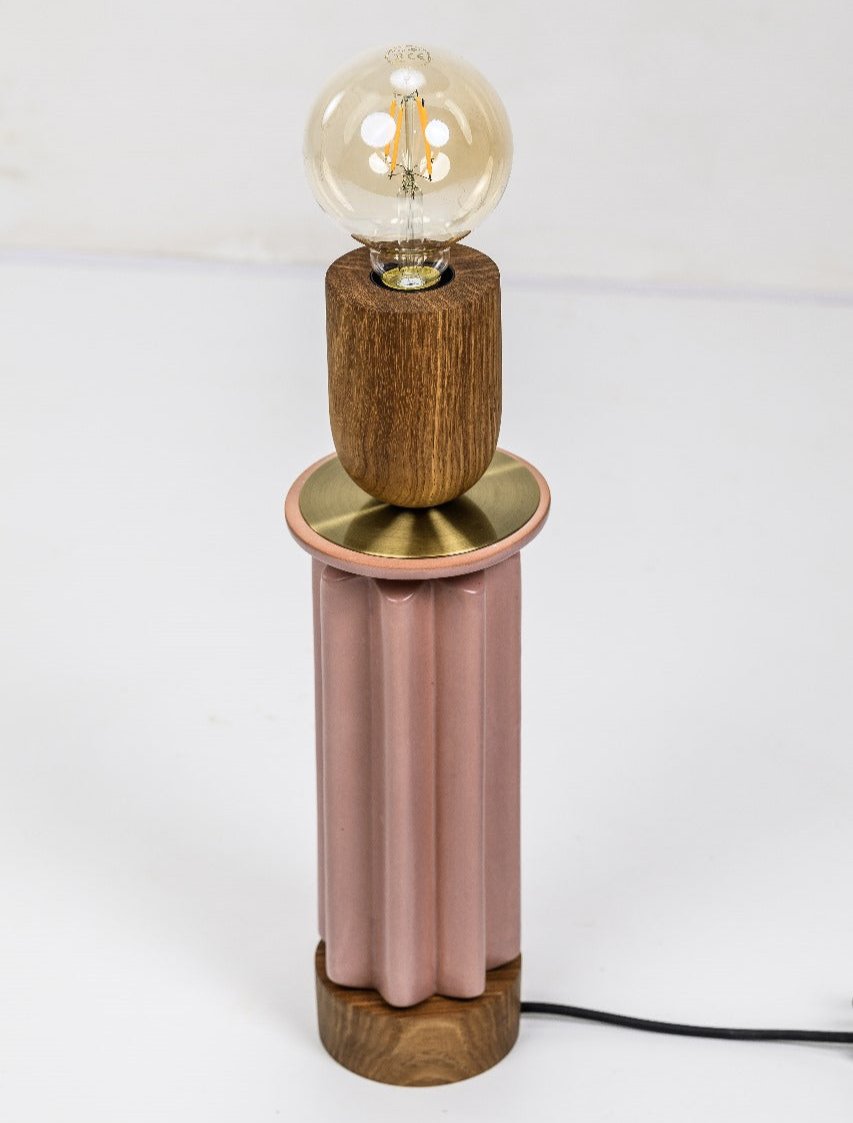 Scallop table lamp in pin and Kiaat word with a illuminated bulb